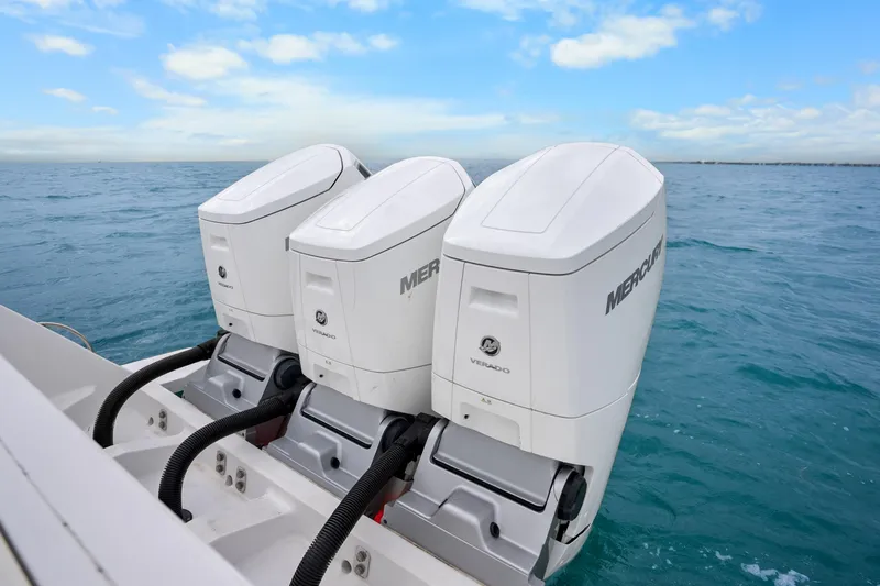 Yacht Photos Pics Triple Mercury Verado engines on 2024 Intrepid 477 Evolution boat in open sea.
