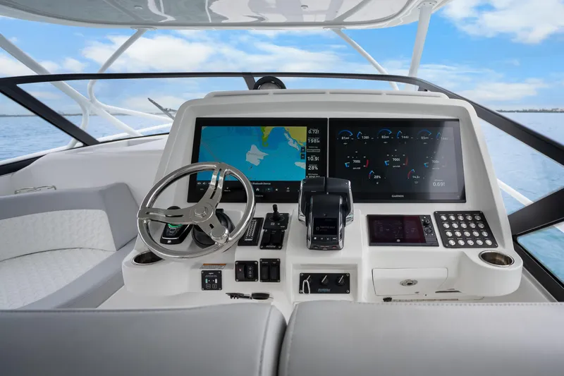  Yacht Photos Pics 2024 Intrepid 477 Evolution helm with advanced navigation and control systems.