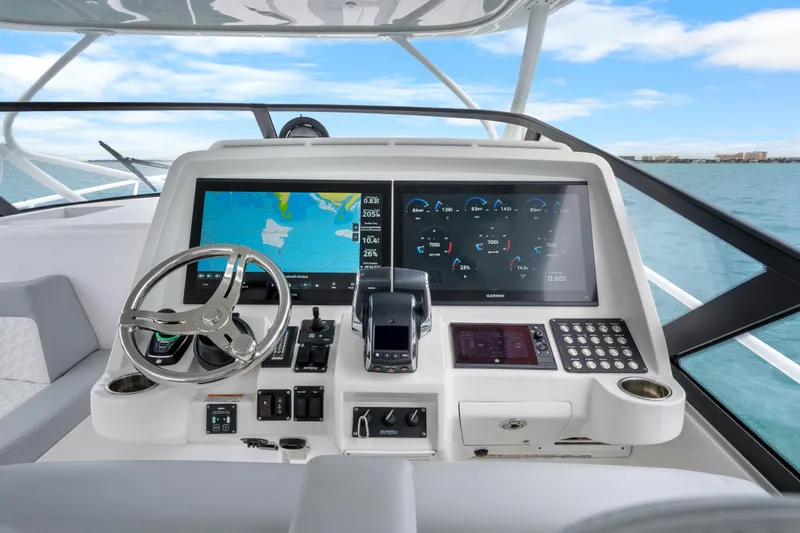  Yacht Photos Pics 2024 Intrepid 477 Evolution helm with advanced navigation and control systems.