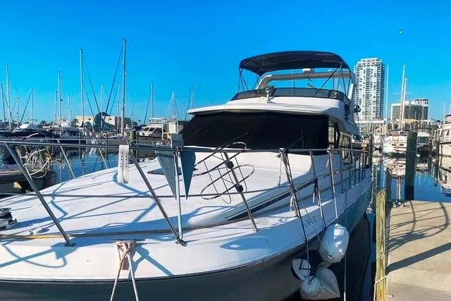 Thistle Do Nicely Yacht Photos Pics 1997 Navigator 4200 yacht docked at marina with clear blue sky.