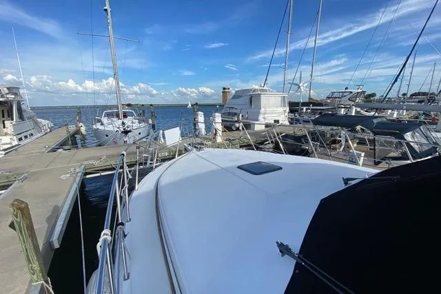 Thistle Do Nicely Yacht Photos Pics 1997 Navigator 4200 yacht docked at marina with clear blue sky.