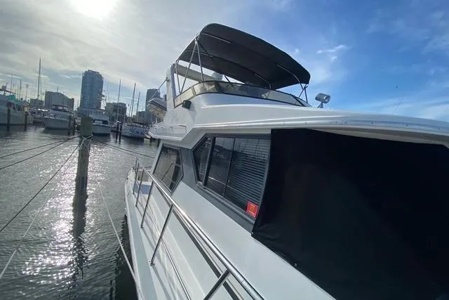 Thistle Do Nicely Yacht Photos Pics 1997 Navigator 4200 yacht docked at marina under a clear blue sky.