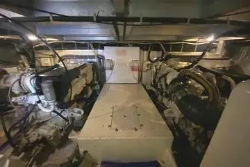 Thistle Do Nicely Yacht Photos Pics Engine room of 1997 Navigator 4200 yacht, showcasing machinery and equipment.