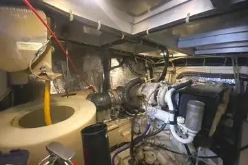 Thistle Do Nicely Yacht Photos Pics Engine room of a 1997 Navigator 4200 yacht, showcasing mechanical components and wiring.