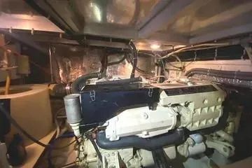 Thistle Do Nicely Yacht Photos Pics Engine room of a 1997 Navigator 4200 yacht, showcasing mechanical components and wiring.