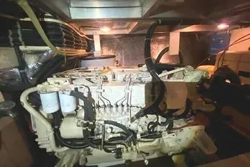 Thistle Do Nicely Yacht Photos Pics Engine room of a 1997 Navigator 4200 yacht, showcasing mechanical components and wiring.