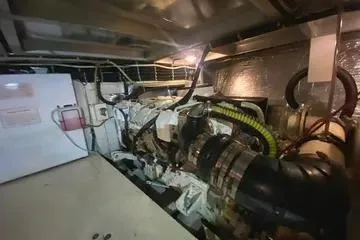 Thistle Do Nicely Yacht Photos Pics Engine room of 1997 Navigator 4200 yacht with visible machinery and wiring.