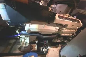 Thistle Do Nicely Yacht Photos Pics Engine room of a 1997 Navigator 4200 yacht, showcasing mechanical components.
