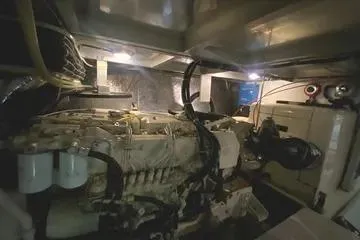 Thistle Do Nicely Yacht Photos Pics Engine room of a 1997 Navigator 4200 yacht, showcasing machinery and components.