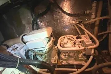 Thistle Do Nicely Yacht Photos Pics Engine room of 1997 Navigator 4200 yacht with visible machinery and piping.