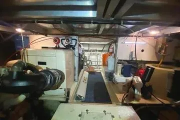 Thistle Do Nicely Yacht Photos Pics Engine room of a 1997 Navigator 4200 yacht, showcasing machinery and equipment.