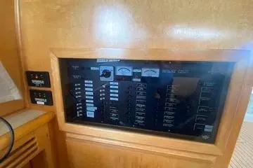 Thistle Do Nicely Yacht Photos Pics Control panel of a 1997 Navigator 4200 yacht with various switches and gauges.