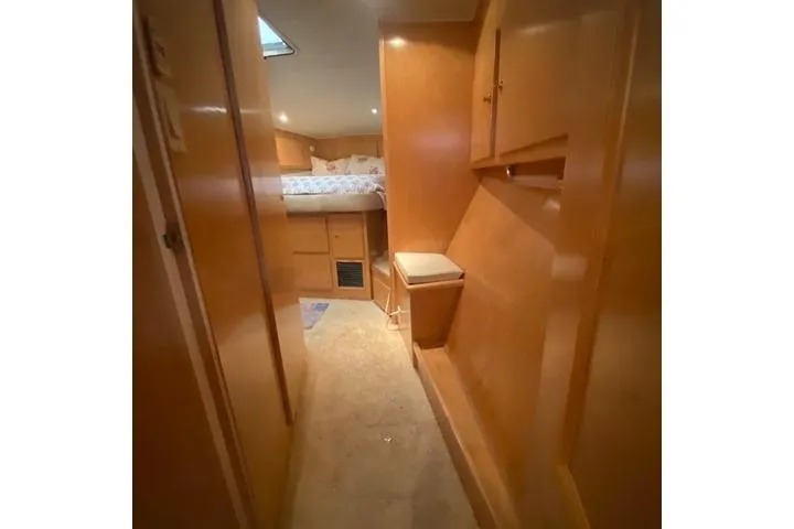 Thistle Do Nicely Yacht Photos Pics Interior of 1997 Navigator 4200 yacht with cozy wooden cabin and bed.