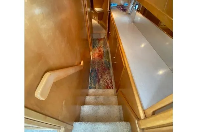 Thistle Do Nicely Yacht Photos Pics Interior view of 1997 Navigator 4200 yacht with stairs and hallway.