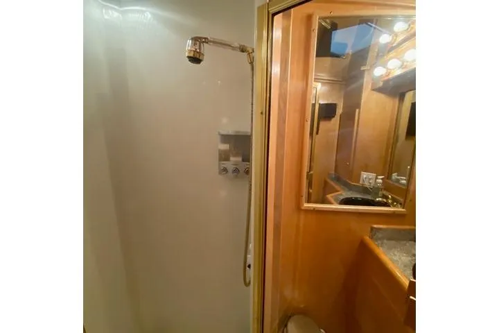 Thistle Do Nicely Yacht Photos Pics Bathroom interior of 1997 Navigator 4200 yacht with shower and vanity.