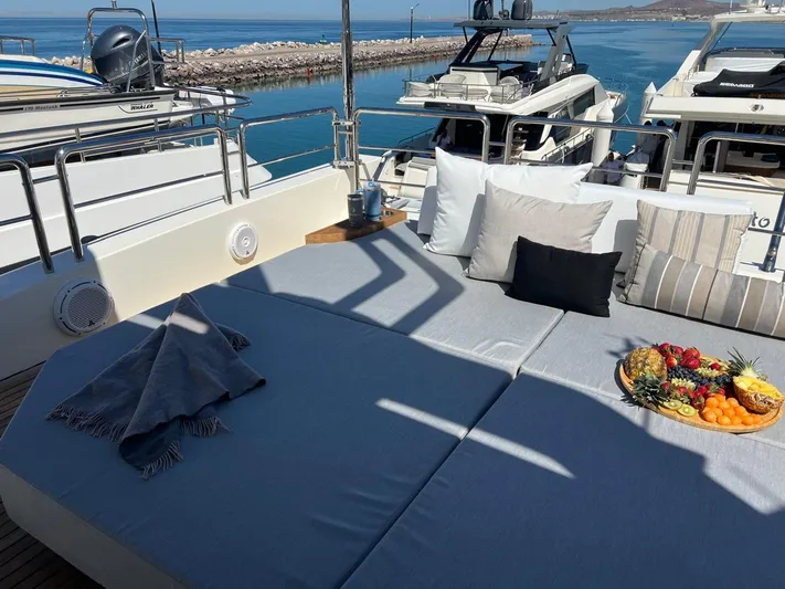 Ganesha Yacht Photos Pics Luxurious Azimut 98 Leonardo yacht deck with cushions and fruit platter, 2003 model.