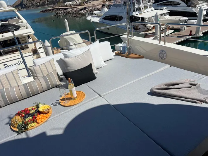 Ganesha Yacht Photos Pics Luxurious Azimut 98 Leonardo yacht deck with fruit platter and wine, 2003 model.