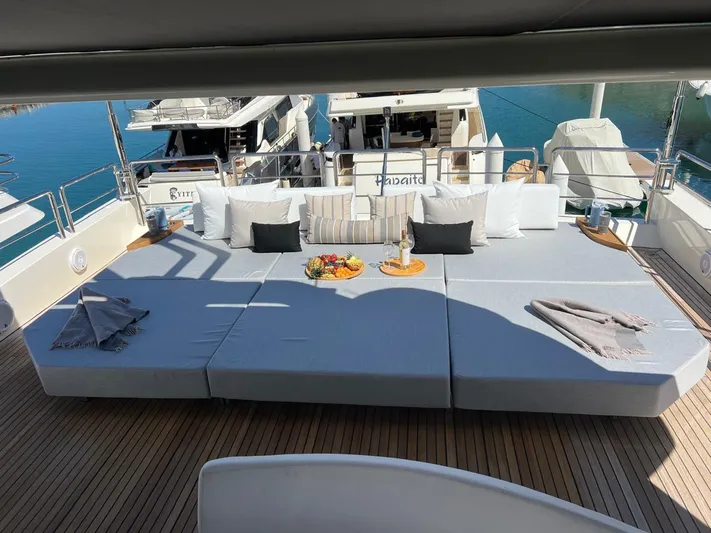 Ganesha Yacht Photos Pics Luxurious deck of 2003 Azimut 98 Leonardo yacht with sun loungers and cushions.