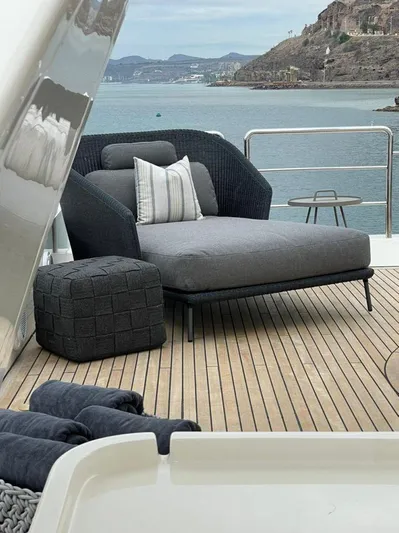 Ganesha Yacht Photos Pics Luxury deck seating on 2003 Azimut 98 Leonardo yacht with scenic ocean view.