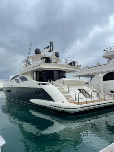 Ganesha Yacht Photos Pics Luxury yacht Azimut 98 Leonardo 2003 docked under cloudy skies.