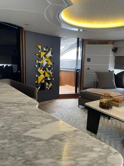 Ganesha Yacht Photos Pics Luxurious interior of 2003 Azimut 98 Leonardo yacht with modern decor and marble surfaces.