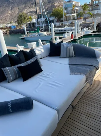 Ganesha Yacht Photos Pics Luxurious Azimut 98 Leonardo yacht deck with plush seating and scenic marina view.