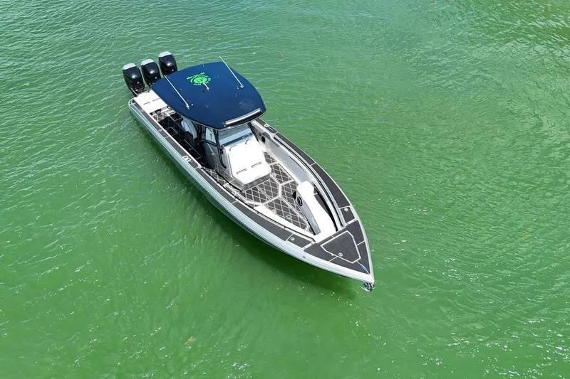 Yacht Photos Pics Aerial view of 2016 Statement 380 Open boat on green water.