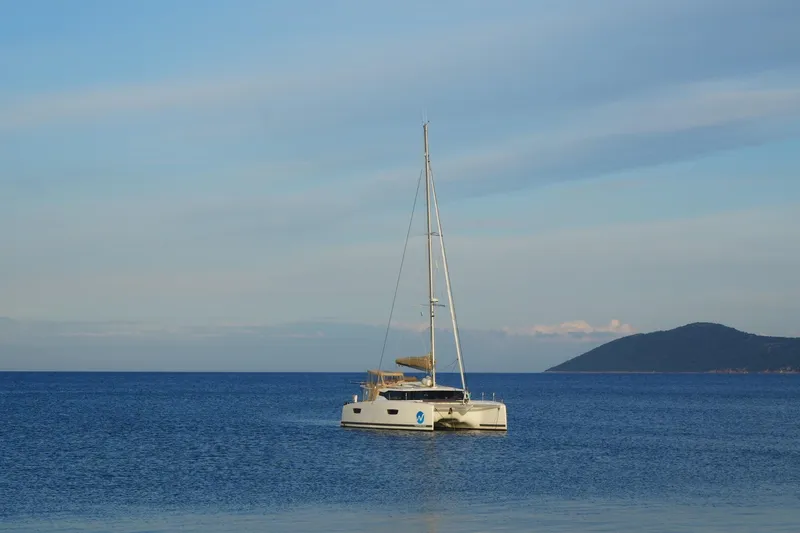 Waymaker Yacht Photos Pics 2018 Fountaine Pajot Saona 47 catamaran sailing on calm blue sea.