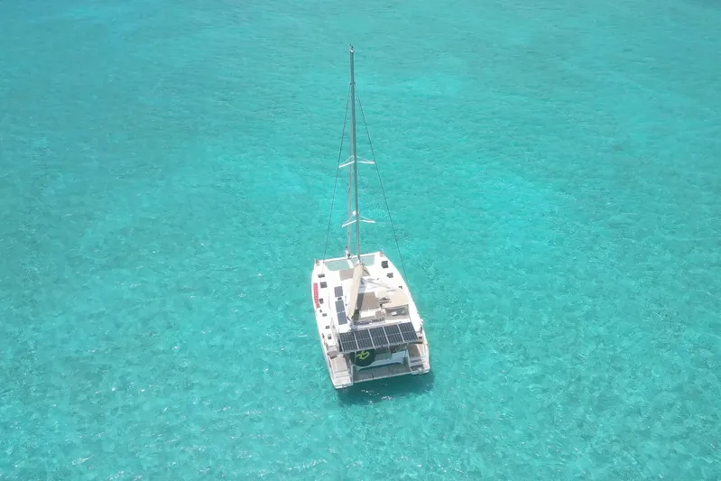 Waymaker Yacht Photos Pics 2018 Fountaine Pajot Saona 47 catamaran sailing on clear turquoise waters.