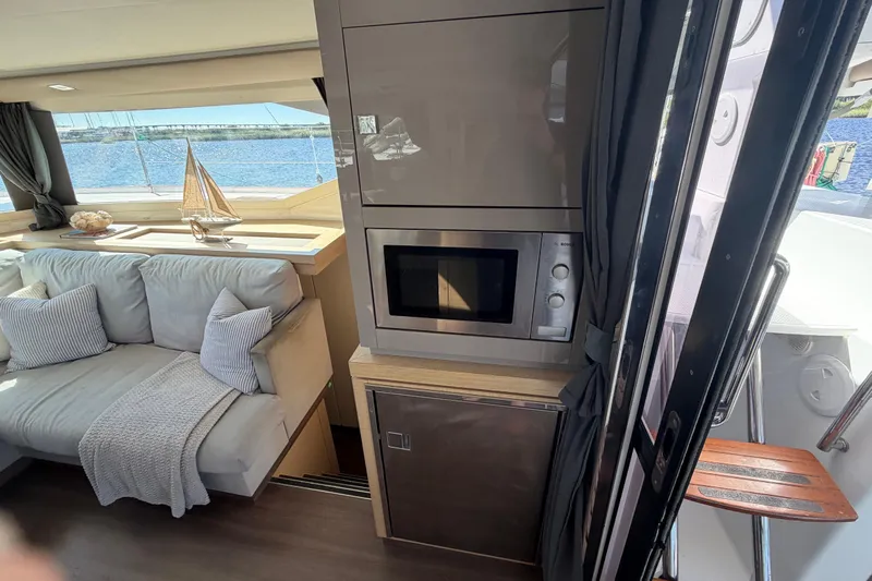 Waymaker Yacht Photos Pics Interior of 2018 Fountaine Pajot Saona 47 yacht with modern kitchen and cozy seating area.