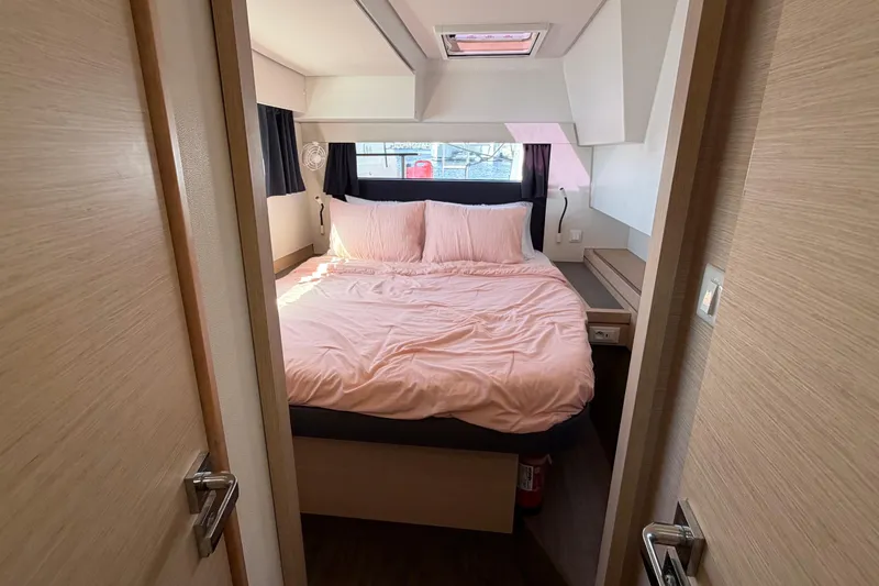 Waymaker Yacht Photos Pics Cozy bedroom in 2018 Fountaine Pajot Saona 47 catamaran with pink bedding and natural light.