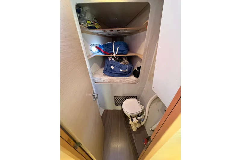 Waymaker Yacht Photos Pics 2018 Fountaine Pajot Saona 47 yacht bathroom with storage shelves and compact toilet.