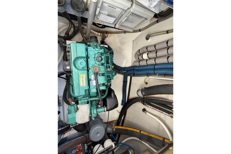 Waymaker Yacht Photos Pics Engine compartment of 2018 Fountaine Pajot Saona 47 catamaran with visible wiring and hoses.