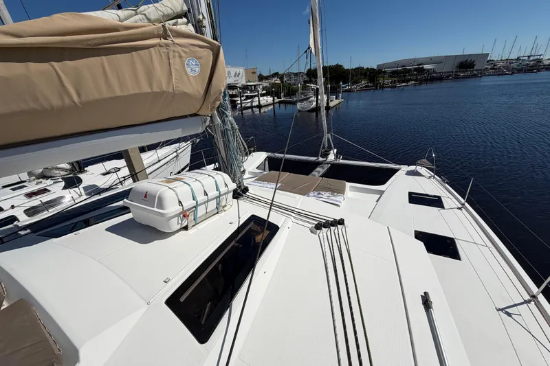 Waymaker Yacht Photos Pics 2018 Fountaine Pajot Saona 47 catamaran docked at marina under clear blue sky.