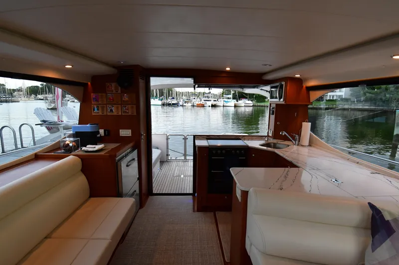 Promesa Yacht Photos Pics Interior of 2021 Hylas M44 yacht with modern kitchen and marina view.