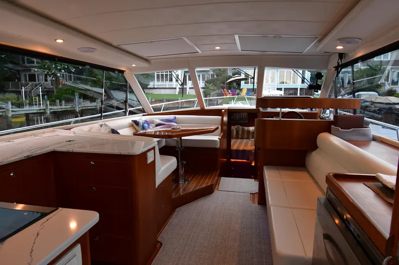 Promesa Yacht Photos Pics Luxurious interior of 2021 Hylas M44 yacht with elegant seating and modern design.