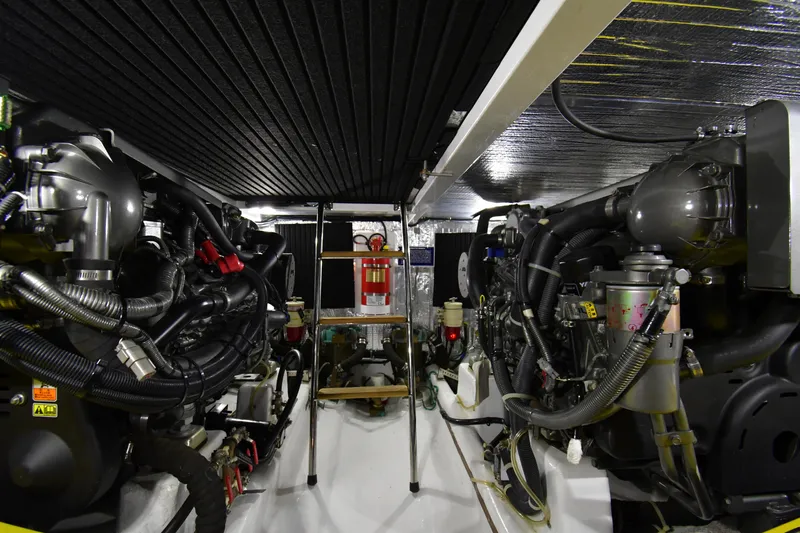 Promesa Yacht Photos Pics Engine room of a 2021 Hylas M44 yacht, featuring complex machinery and equipment.
