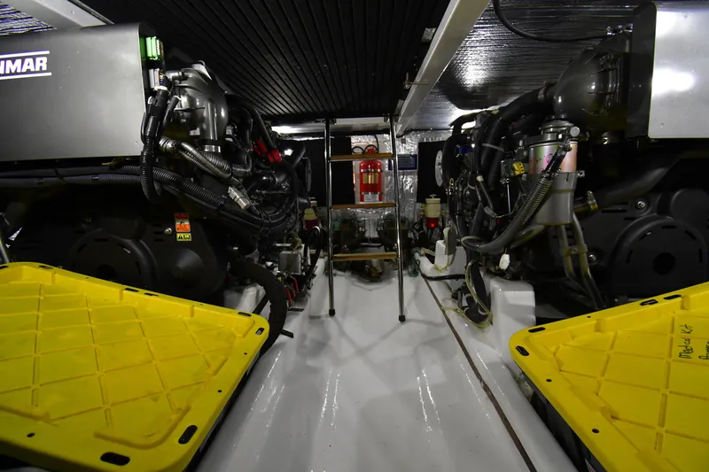 Promesa Yacht Photos Pics Engine room of 2021 Hylas M44 yacht, featuring dual Yanmar engines and safety equipment.