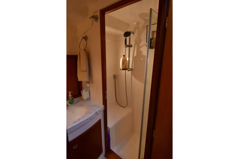 Promesa Yacht Photos Pics Bathroom interior of 2021 Hylas M44 yacht with shower and sink.