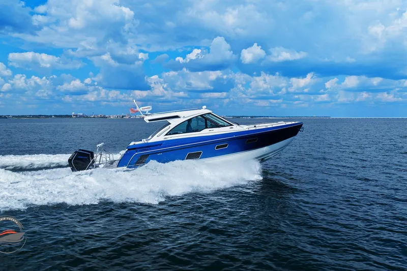 Lucca 2 Yacht Photos Pics 2025 Formula 380 Super Sport Crossover OB cruising on open water under a blue sky.