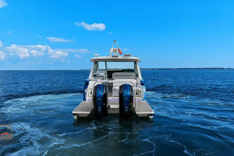 Lucca 2 Yacht Photos Pics 2025 Formula 380 Super Sport Crossover OB on open water, rear view.