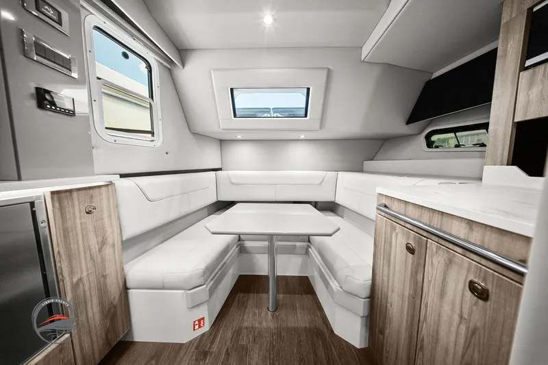 Lucca 2 Yacht Photos Pics 2025 Formula 380 Super Sport Crossover OB interior with modern seating and wood accents.