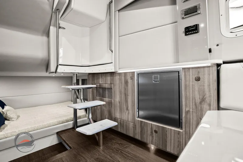 Lucca 2 Yacht Photos Pics 2025 Formula 380 Super Sport Crossover OB interior with modern wood cabinetry and compact stairs.