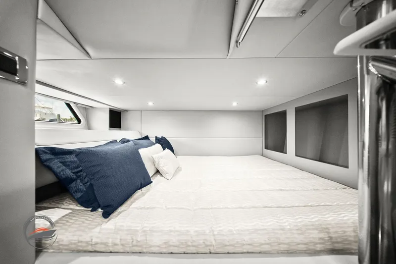 Lucca 2 Yacht Photos Pics 2025 Formula 380 Super Sport Crossover OB cabin interior with bed and pillows.