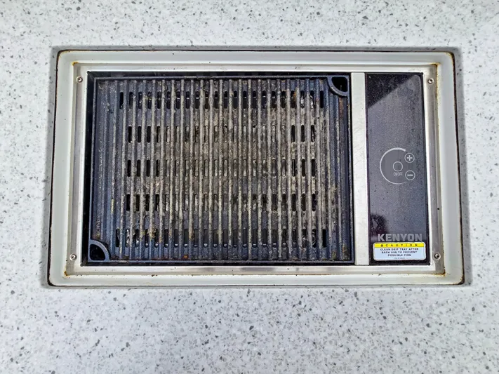 Calypso Yacht Photos Pics Built-in Kenyon grill on 2020 Aquila 36 Sport boat deck.