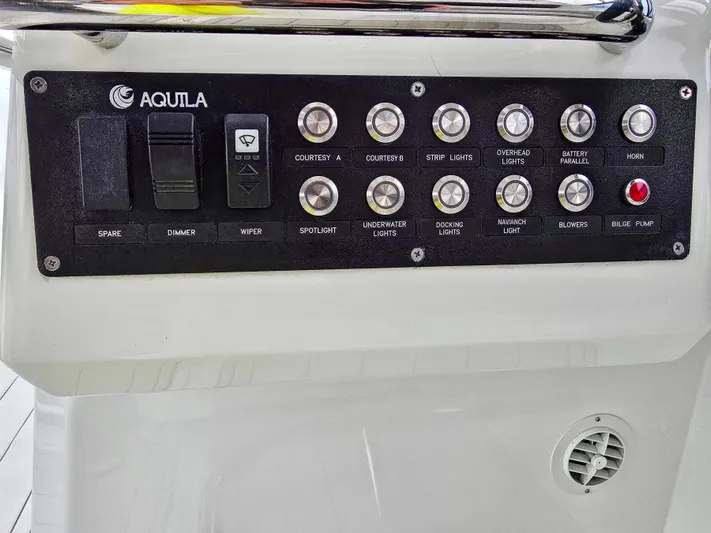 Calypso Yacht Photos Pics Control panel of 2020 Aquila 36 Sport boat with various switches and buttons.