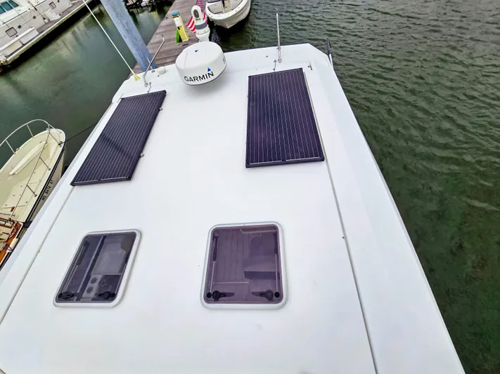 Calypso Yacht Photos Pics Aquila 36 Sport 2020 boat roof with solar panels and Garmin equipment.