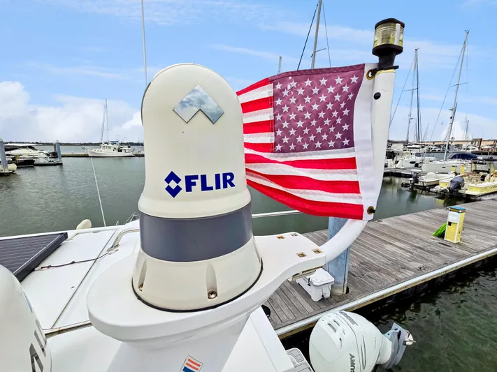 Calypso Yacht Photos Pics Aquila 36 Sport 2020 with FLIR system and American flag at marina.