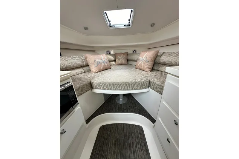  Yacht Photos Pics 2020 Stamas 326 Aegean cabin interior with cozy seating and decorative pillows.