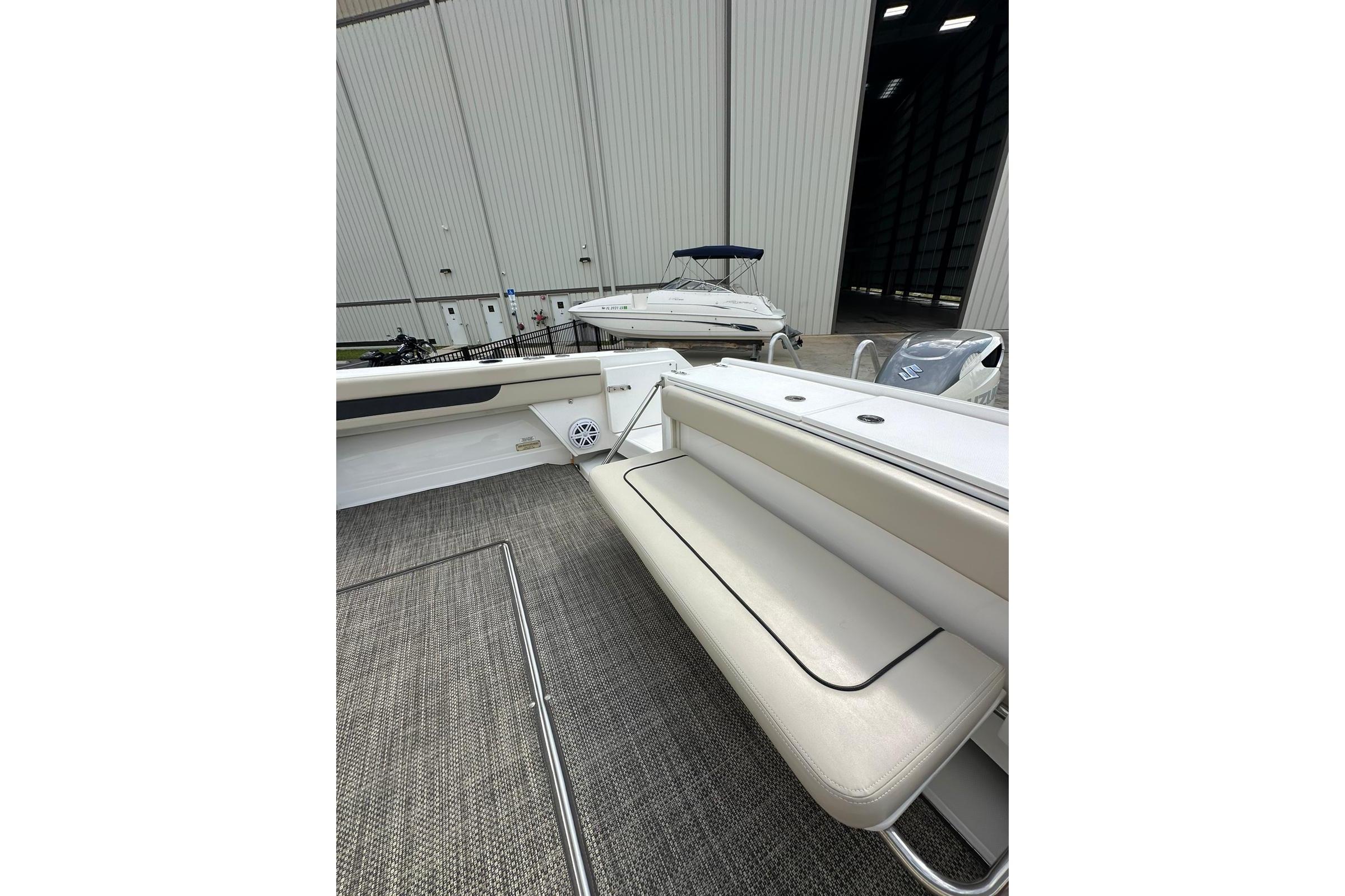 2020 Stamas 326 Aegean boat interior with seating and storage, docked in a marina.